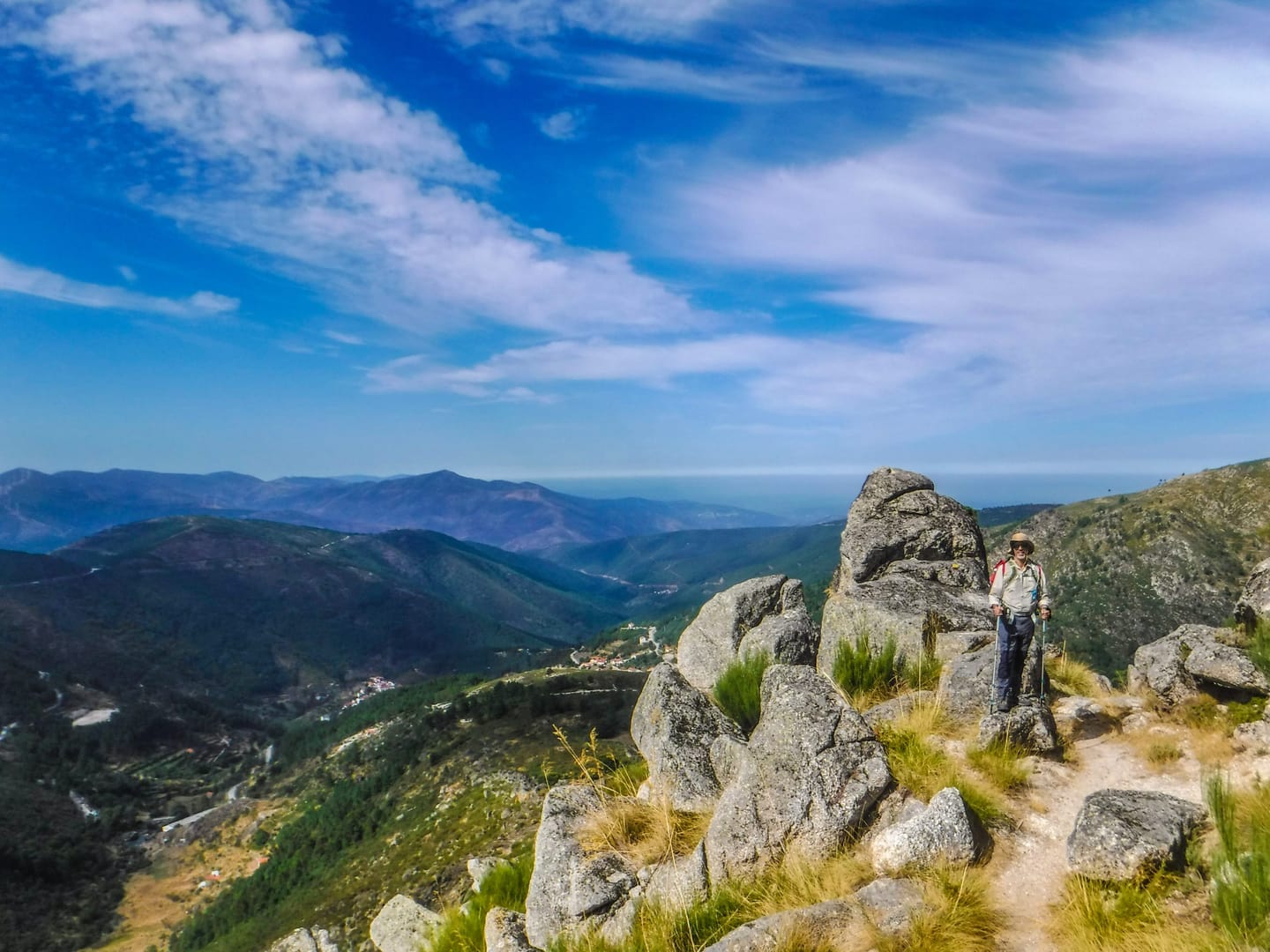 Person beside rocks overlooking Serra da Estrela