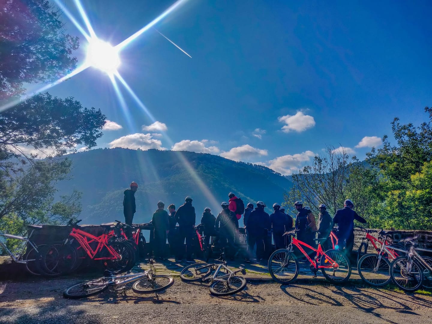 Group and mountain bikes at a stopping point