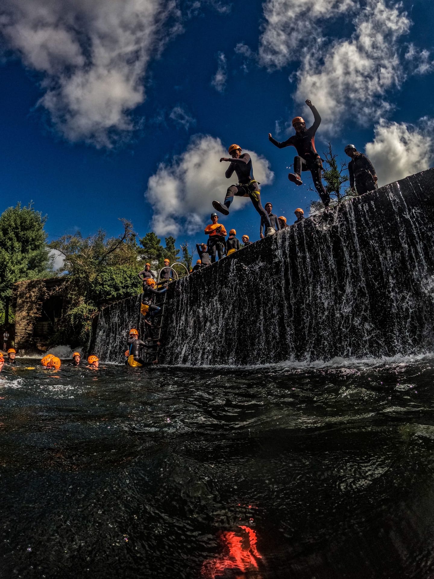 Participants in the water beside an Alva weir in Côja